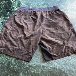 Lululemon athletic shorts, 7 inch. Size large, black and grey.